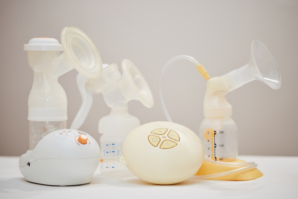 Different Breast Pumps on Table. Maternity and Child Care.